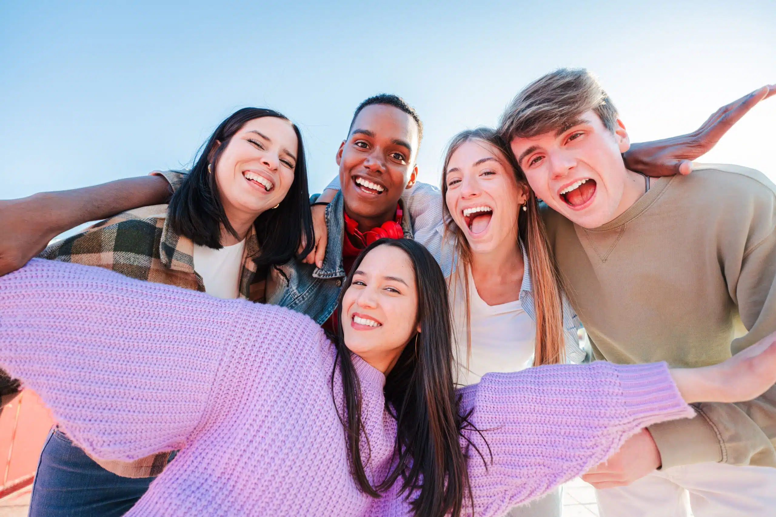 Group of friends smiling together representing healthy smiles and overall well-being