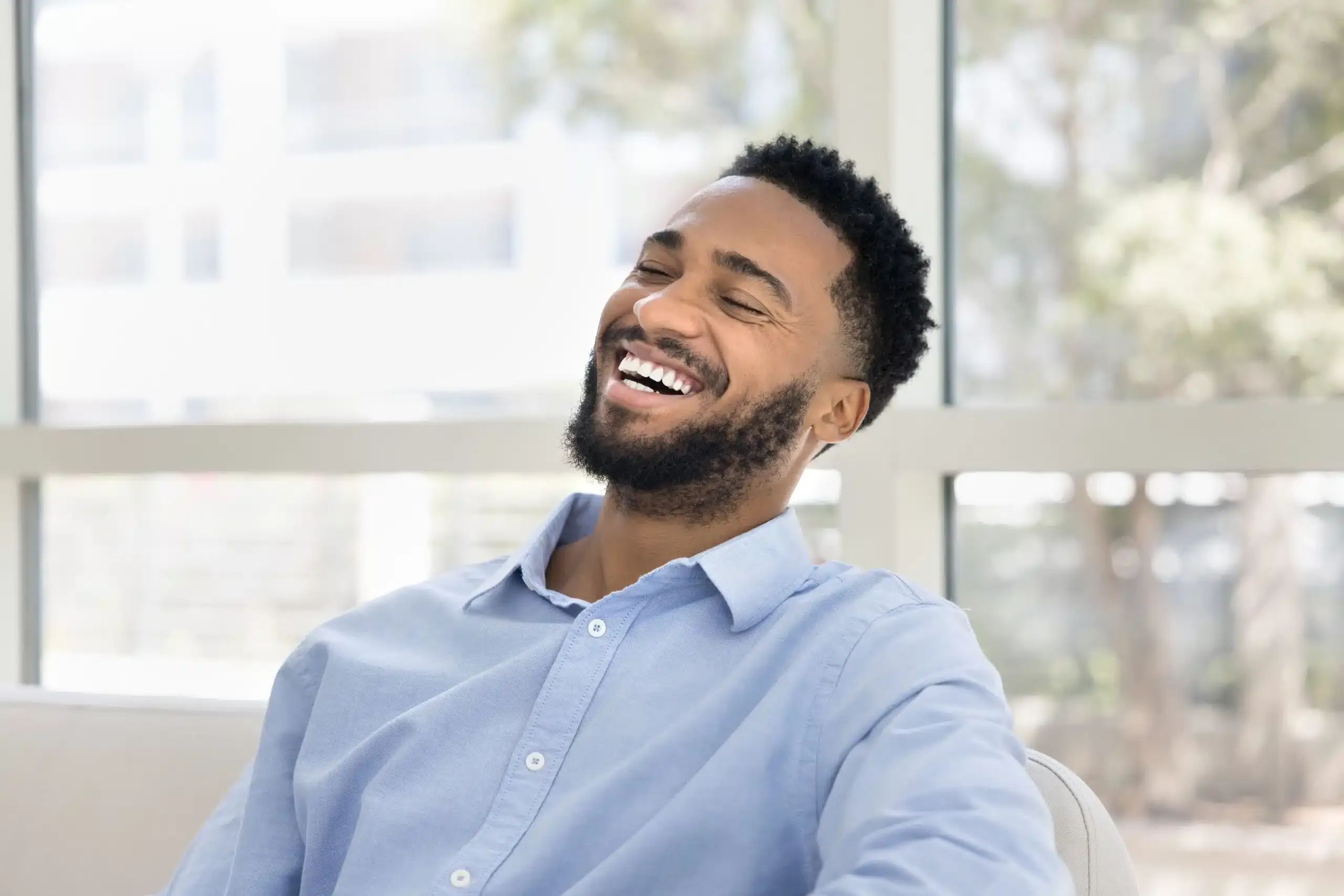Patient smiling during a visit to the dental office
