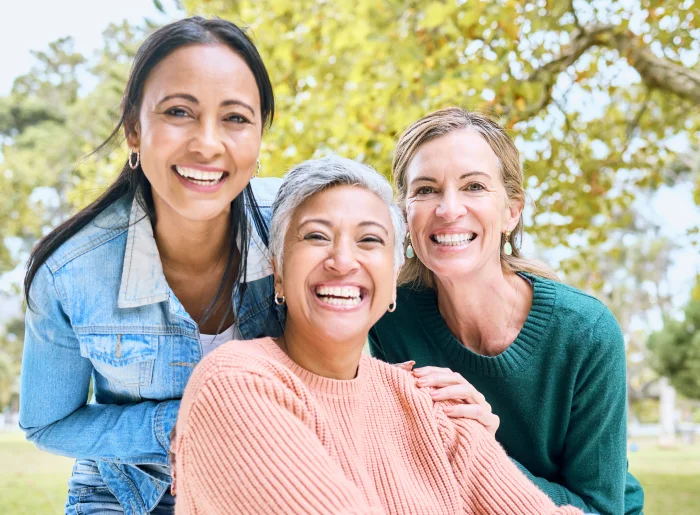 Woman smiling confidently after a personalized smile makeover treatment